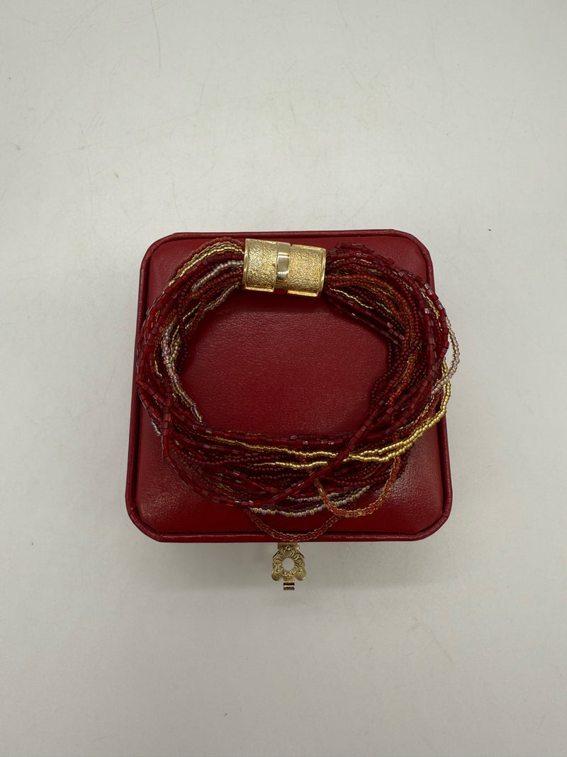 red and gold bracelet