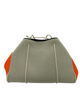 haute shore beige and orange handbags